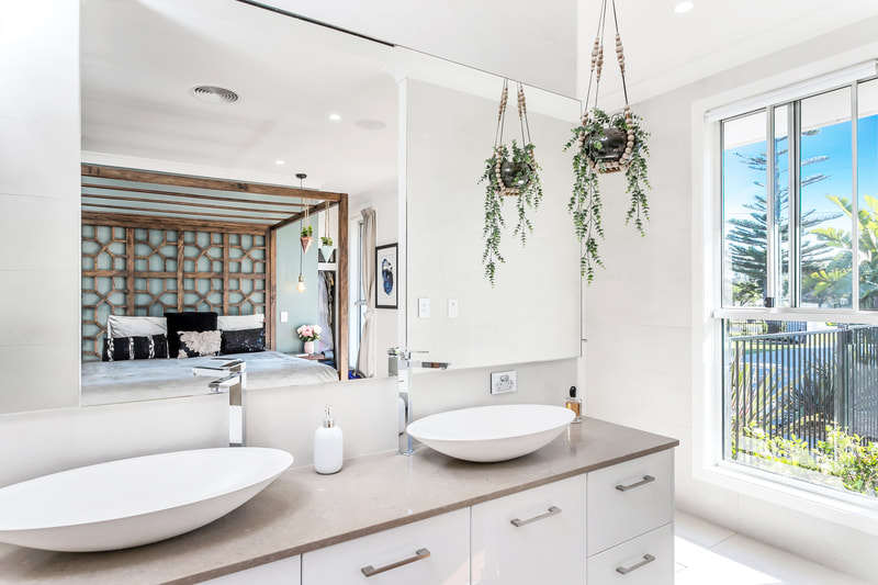 Modern bathroom design, with grey & white tones and beautiful long vanity basin bowls. 